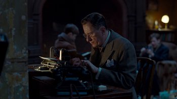 Movie still from “The King's Speech” (2010), directed by Tom Hooper – An older man is typing on an old typewriter; Medium shot, Low angle