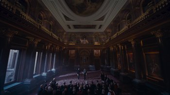 Movie still from “The King's Speech” (2010), directed by Tom Hooper – A large group of people in a large room; Extreme Wide shot, High angle