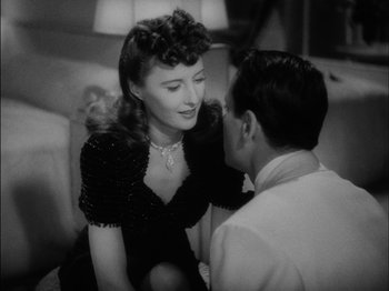 Movie still from “The Lady Eve” (1941), directed by Preston Sturges – An old photo of a man and a woman talking; Close Up shot, High angle