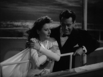 Movie still from “The Lady Eve” (1941), directed by Preston Sturges – A man and a woman are standing next to each other; Medium shot, High angle