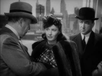 Movie still from “The Lady Eve” (1941), directed by Preston Sturges – An old black and white photo of a man and a woman; Medium shot, Over the shoulder angle