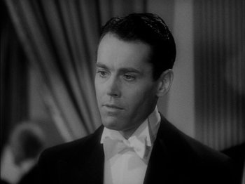 Movie still from “The Lady Eve” (1941), directed by Preston Sturges – A man wearing a suit and a bow tie; Close Up shot, High angle