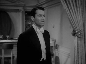 Movie still from “The Lady Eve” (1941), directed by Preston Sturges – A black and white photo of a man in a tuxedo; Medium shot, Low angle