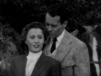 Movie still from “The Lady Eve” (1941), directed by Preston Sturges – A man and a woman standing next to each other; Close Up shot, High angle