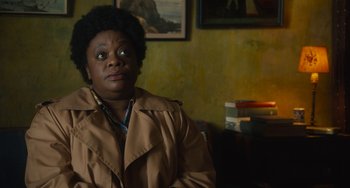 Movie still from “The Lady in the Van” (2015), directed by Nicholas Hytner – An older black woman sitting in a room; Close Up shot, Over the shoulder angle
