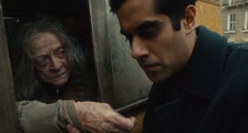 Movie still from “The Lady in the Van” (2015), directed by Nicholas Hytner – An older woman looking at a young man's face; Close Up shot, Over the shoulder angle