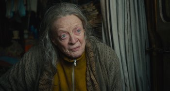 Movie still from “The Lady in the Van” (2015), directed by Nicholas Hytner – An old woman with a sad look on her face; Close Up shot, High angle