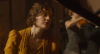 Movie still from “The Lady in the Van” (2015), directed by Nicholas Hytner – A woman in a yellow sweater looking to her left; Close Up shot, Low angle