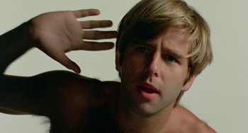 Movie still from “The Landlord” (1970), directed by Hal Ashby – A person with his hand up; Close Up shot, Low angle