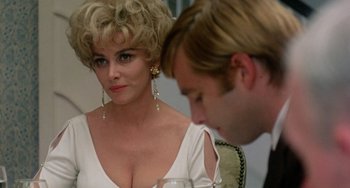 Movie still from “The Landlord” (1970), directed by Hal Ashby – A woman sitting next to a man in front of a mirror; Close Up shot, Over the shoulder angle