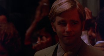 Movie still from “The Landlord” (1970), directed by Hal Ashby – A person wearing a suit and tie; Close Up shot, Over the shoulder angle