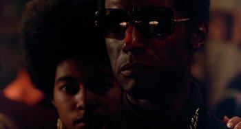 Movie still from “The Landlord” (1970), directed by Hal Ashby – A person wearing sunglasses; Close Up shot, Low angle