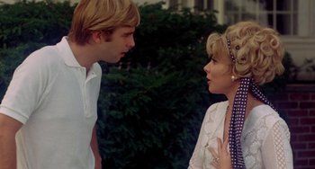 Movie still from “The Landlord” (1970), directed by Hal Ashby – A man and a woman talking to each other; Close Up shot, Over the shoulder angle