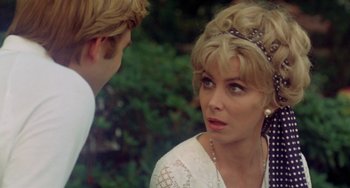 Movie still from “The Landlord” (1970), directed by Hal Ashby – A man and a woman talking to each other outside; Close Up shot, Over the shoulder angle