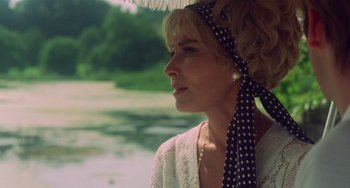 Movie still from “The Landlord” (1970), directed by Hal Ashby – A woman wearing a polka dot head scarf and a white blouse; Close Up shot, Low angle