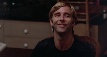 Movie still from “The Landlord” (1970), directed by Hal Ashby – A man with blonde hair smiling for the camera; Close Up shot, Low angle