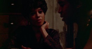 Movie still from “The Landlord” (1970), directed by Hal Ashby – A man and a woman sitting at a table talking to each other; Close Up shot, Over the shoulder angle