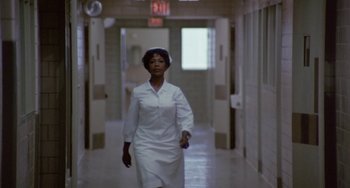 Movie still from “The Landlord” (1970), directed by Hal Ashby – A woman walking down a hallway in a hospital; Wide shot, Low angle