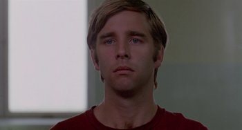 Movie still from “The Landlord” (1970), directed by Hal Ashby – A person wearing a red t - shirt; Close Up shot, Low angle