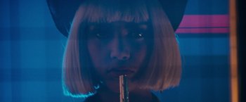 Movie still from “The Last Boy Scout” (1991), directed by Tony Scott – A woman with blonde hair is holding a pipe; Close Up shot, Low angle