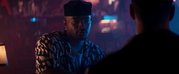 Movie still from “The Last Boy Scout” (1991), directed by Tony Scott – A man with a hat is looking at the camera; Close Up shot, Over the shoulder angle