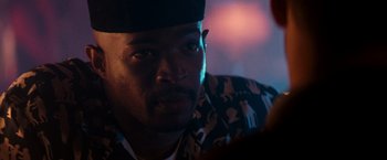 Movie still from “The Last Boy Scout” (1991), directed by Tony Scott – A person wearing a hat; Close Up shot, Over the shoulder angle