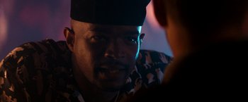 Movie still from “The Last Boy Scout” (1991), directed by Tony Scott – A person wearing a hat; Close Up shot, Over the shoulder angle