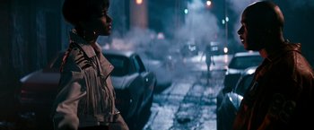 Movie still from “The Last Boy Scout” (1991), directed by Tony Scott – A woman standing on the side of a road in the middle of the night; Wide shot, Over the shoulder angle