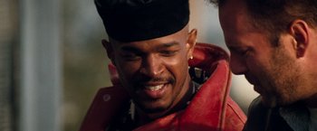 Movie still from “The Last Boy Scout” (1991), directed by Tony Scott – A person wearing a jacket and a hat; Close Up shot, Low angle