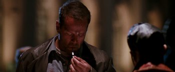 Movie still from “The Last Boy Scout” (1991), directed by Tony Scott – A person holding a cigarette in his mouth; Close Up shot, Low angle