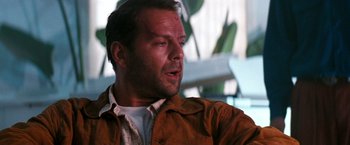 Movie still from “The Last Boy Scout” (1991), directed by Tony Scott – A person wearing a brown jacket; Close Up shot, Over the shoulder angle