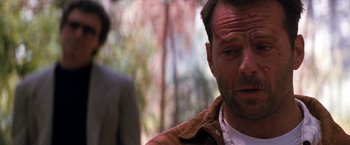 Movie still from “The Last Boy Scout” (1991), directed by Tony Scott – A person wearing a brown jacket; Close Up shot, Over the shoulder angle