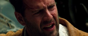 Movie still from “The Last Boy Scout” (1991), directed by Tony Scott – A man's face with his eyes closed; Close Up shot, Over the shoulder angle