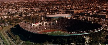 Movie still from “The Last Boy Scout” (1991), directed by Tony Scott – An aerial view of a large stadium with a lot of fans; Extreme Wide shot, High angle