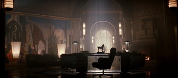 Movie still from “The Last Boy Scout” (1991), directed by Tony Scott – A chair and a desk in a room with lights on; Extreme Wide shot, Low angle