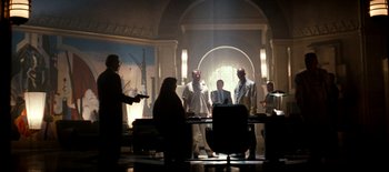 Movie still from “The Last Boy Scout” (1991), directed by Tony Scott – A group of people standing around a room; Wide shot, Low angle