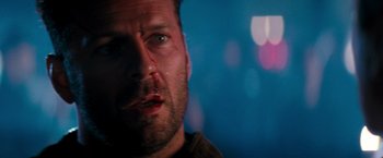 Movie still from “The Last Boy Scout” (1991), directed by Tony Scott – A person with a bandage on his face; Close Up shot, Low angle