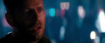 Movie still from “The Last Boy Scout” (1991), directed by Tony Scott – A man's face with a blurry background; Close Up shot, Low angle