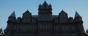 Movie still from “The Last Castle” (2001), directed by Rod Lurie – A large building with a clock tower on the top of it; Extreme Wide shot, Low angle