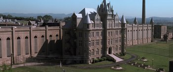 Movie still from “The Last Castle” (2001), directed by Rod Lurie – An aerial view of a large building with a large staircase; Extreme Wide shot, High angle