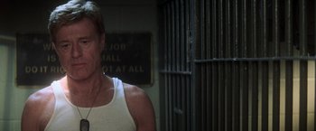 Movie still from “The Last Castle” (2001), directed by Rod Lurie – A man standing in front of a jail cell; Close Up shot, Over the shoulder angle
