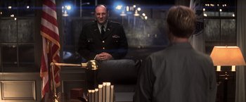 Movie still from “The Last Castle” (2001), directed by Rod Lurie – A man in a military uniform sitting in front of a mirror; Medium shot, Over the shoulder angle