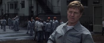 Movie still from “The Last Castle” (2001), directed by Rod Lurie – A man standing in front of a group of people; Close Up shot, Over the shoulder angle