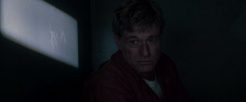 Movie still from “The Last Castle” (2001), directed by Rod Lurie – A person wearing a red jacket; Close Up shot, Low angle