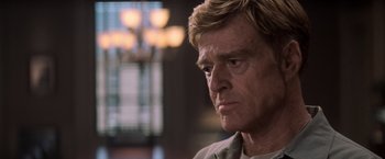 Movie still from “The Last Castle” (2001), directed by Rod Lurie – A person wearing a white shirt; Close Up shot, Over the shoulder angle