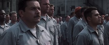 Movie still from “The Last Castle” (2001), directed by Rod Lurie – A group of men standing next to each other; Close Up shot, High angle