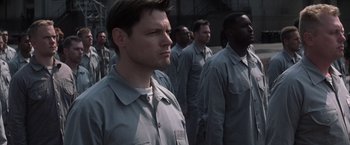 Movie still from “The Last Castle” (2001), directed by Rod Lurie – A group of men standing next to each other; Close Up shot, High angle