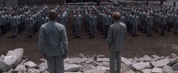 Movie still from “The Last Castle” (2001), directed by Rod Lurie – A group of men standing in front of each other; Wide shot, High angle