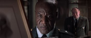 Movie still from “The Last Castle” (2001), directed by Rod Lurie – A person wearing a uniform; Close Up shot, Low angle