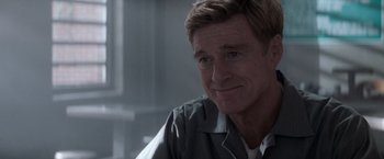 Movie still from “The Last Castle” (2001), directed by Rod Lurie – A person sitting in front of a window; Close Up shot, Over the shoulder angle